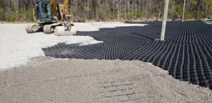 Gravel driveway showing surface stability challenges and grid reinforcement use