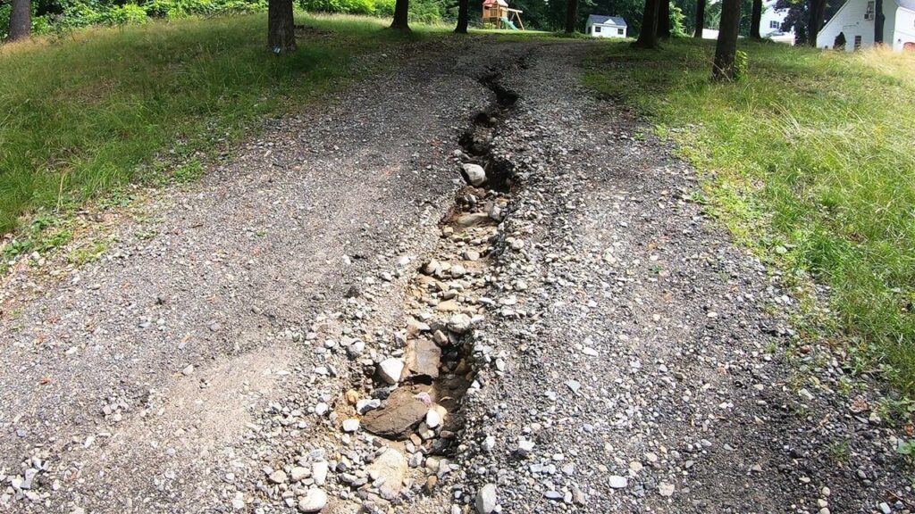 Rutting and deformation in weak subgrade where reinforcement alone may not solve drainage-related failure