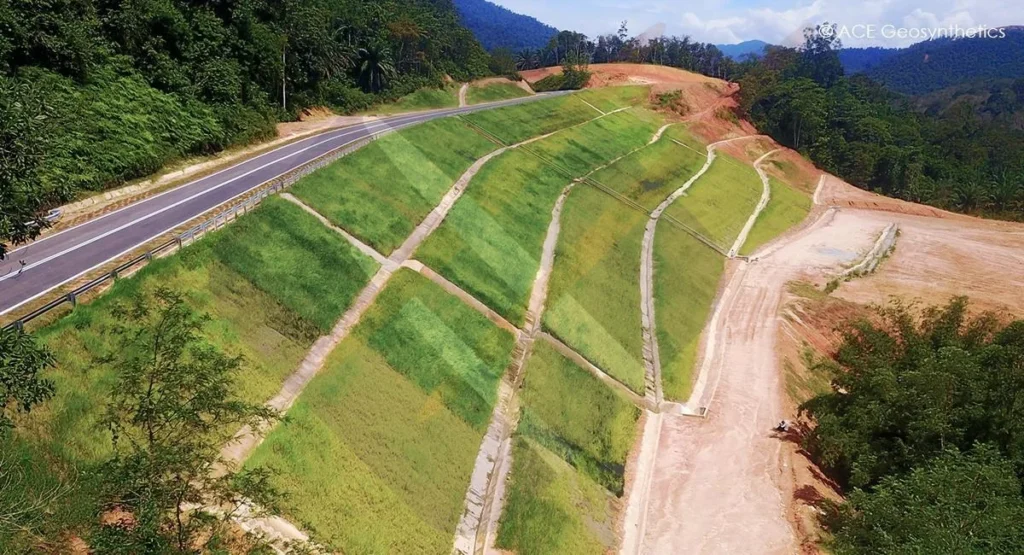 completed highway slope stabilization project using geomat fabric